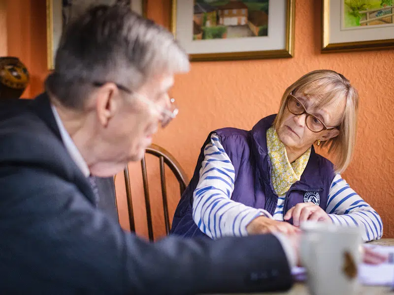Estate Planning expert Martin Wollaston talking about Wills and Trusts with a female client.